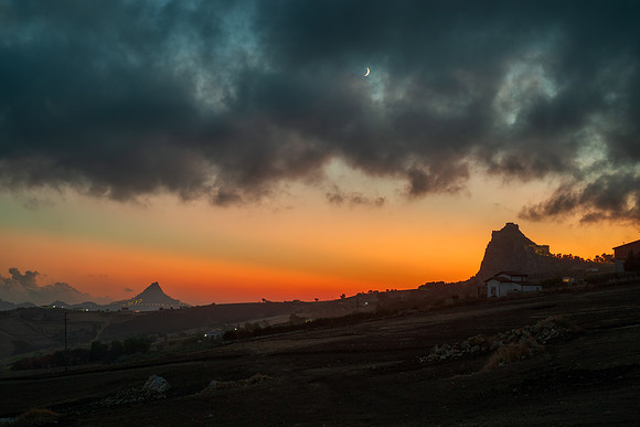 Crepuscular Rays and Earthshine Moon Above Mussomeli Castle