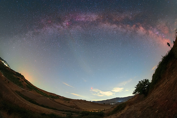 Milky Way and Red Moon Above Sicilian Countryside