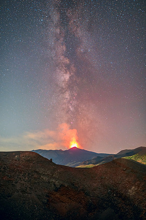Heavenly Fire and Earthly Fire Meeting on Mount Etna Volcano