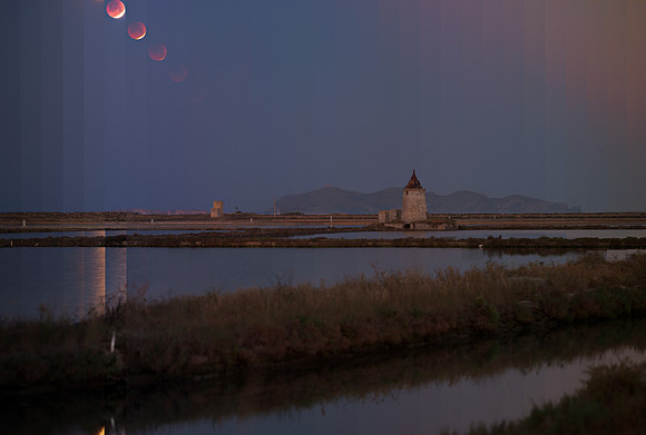 Lunar Eclipse With Changing Light Above The Salt Ponds Of Trapani