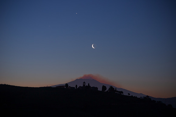 Venus Jupiter and Earthshine Moon Alignment Above Mount Etna and Borgo Giuliano